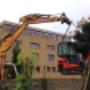 minigraver 1,9T over tuinmuur