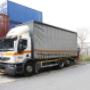 Vrachtwagen mt huif & Kooi–aap