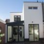 Nieuwe gevel met serre-aanbouw