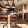 Modern interior of Floor17 restaurant in Amsterdam is always a place for comfortable seating, modern design, and a warm atmosphere for lunch, dinner, and relaxed dining with city views.