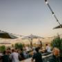 Sunset drinks at Floor17 rooftop terrace in Amsterdam, featuring a lively social atmosphere with panoramic city views, ideal for after-work drinks and evening gatherings.