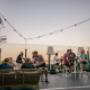 Sunset drinks at Floor17 rooftop terrace in Amsterdam, is always a lively social atmosphere with panoramic city views evening gatherings.