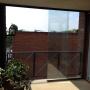 Glazen schuifwand op balkon