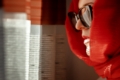 close-up-man-wearing-sunglasses-standing-by-window