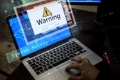 computer-with-warning-pop-up-sign-window