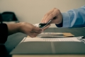 midsection-people-using-smart-phone-table